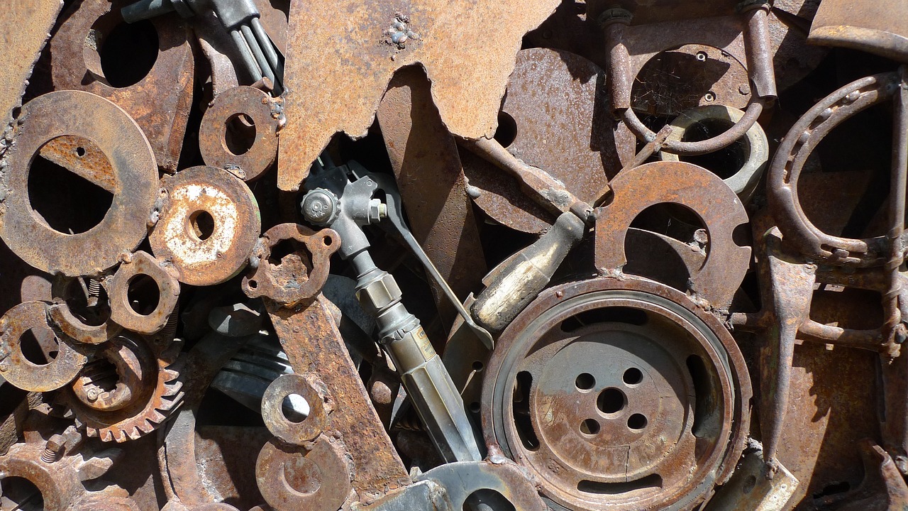 a close up of a bunch of rusty gears, inspired by Max Ernst, assemblage, tools and junk on the ground, photograph taken in 2 0 2 0, gun scraps, laquer and steel