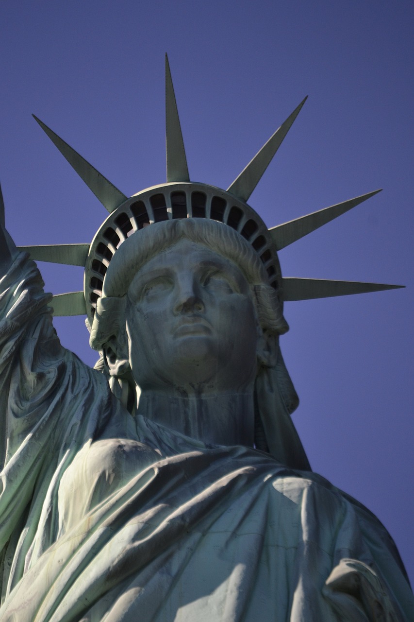 a close up of a statue of liberty against a blue sky, a statue, art nouveau, usa-sep 20, 4 0 9 6, family friendly, small stature