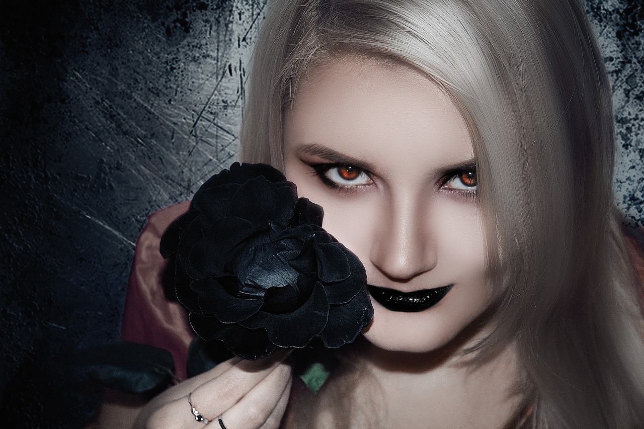 a close up of a person holding a flower, a photo, inspired by Samuel Hieronymus Grimm, gothic art, pretty margot robbie vampire, taken with canon 5d mk4, kerli koiv as anime girl, avatar image