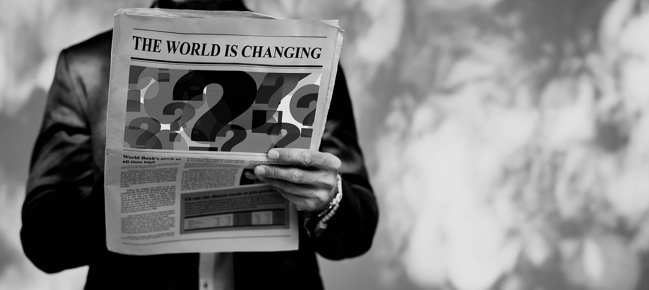 a black and white photo of a man reading a newspaper, a photo, trending on pexels, happening, asking for change, climate change, 2 0 2 2 photo, second coming