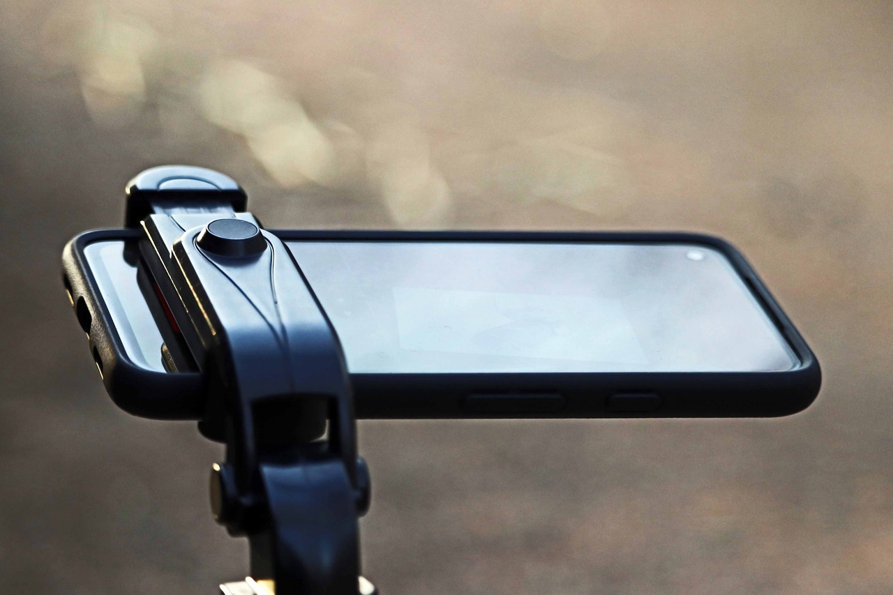 a close up of a cell phone on a bike handlebar, a picture, by Adam Rex, realism, film cam, glass oled visor head, shooting angle from below, profile close-up view