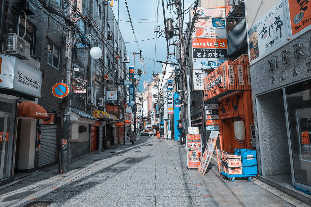 a street filled with lots of shops next to tall buildings, a picture, shutterstock, ukiyo-e, strong blue and orange colors, high detail photo of a deserted, stock photo, desaturated color