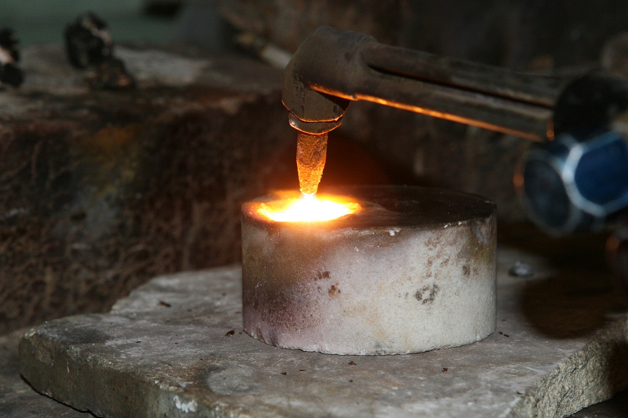 a close up of a metal object with a flame coming out of it, figuration libre, working in the forge, candle wax, high quality product image”, malaysian