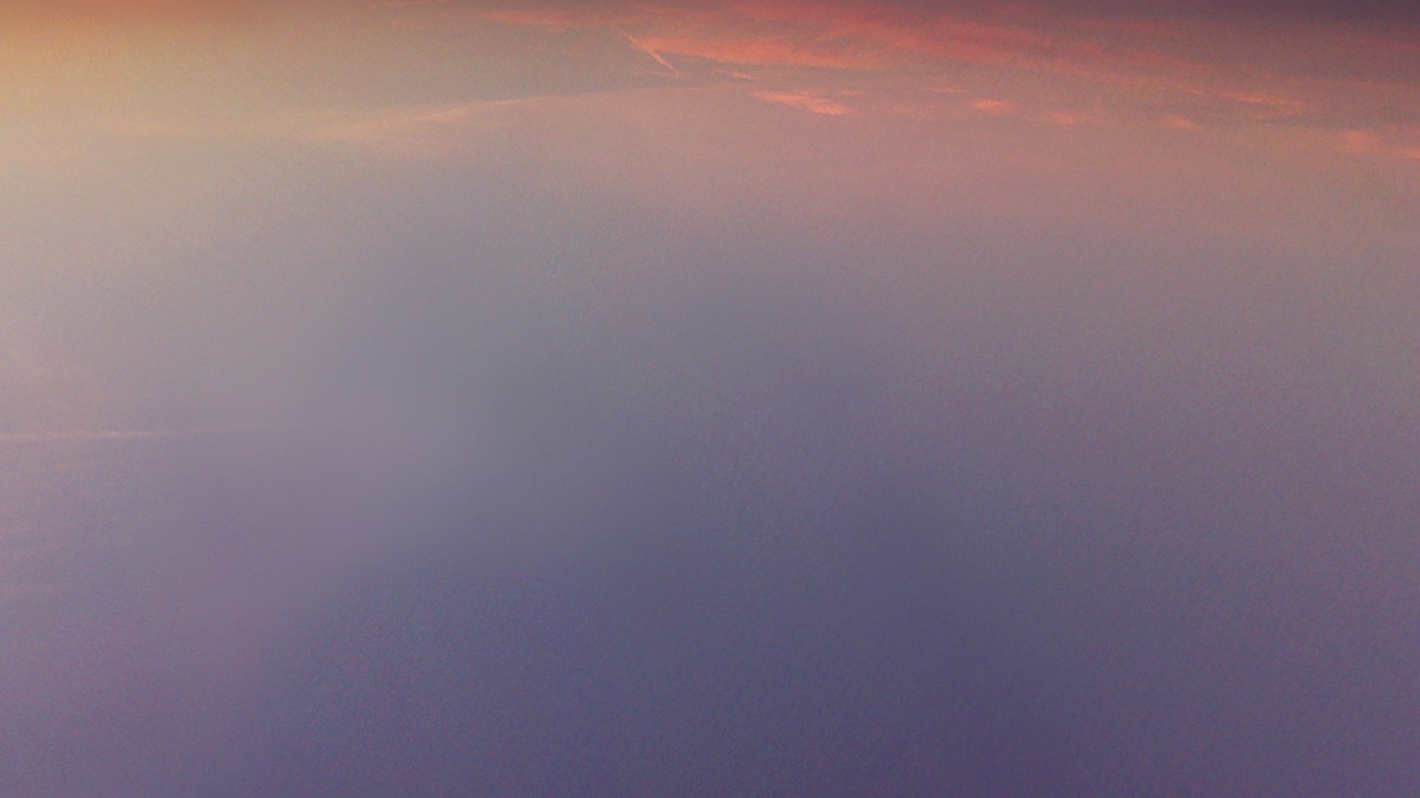a large jetliner flying through a cloudy sky, a picture, minimalism, redpink sunset, view from slightly above, in the astral plane ) ) ), purple fog