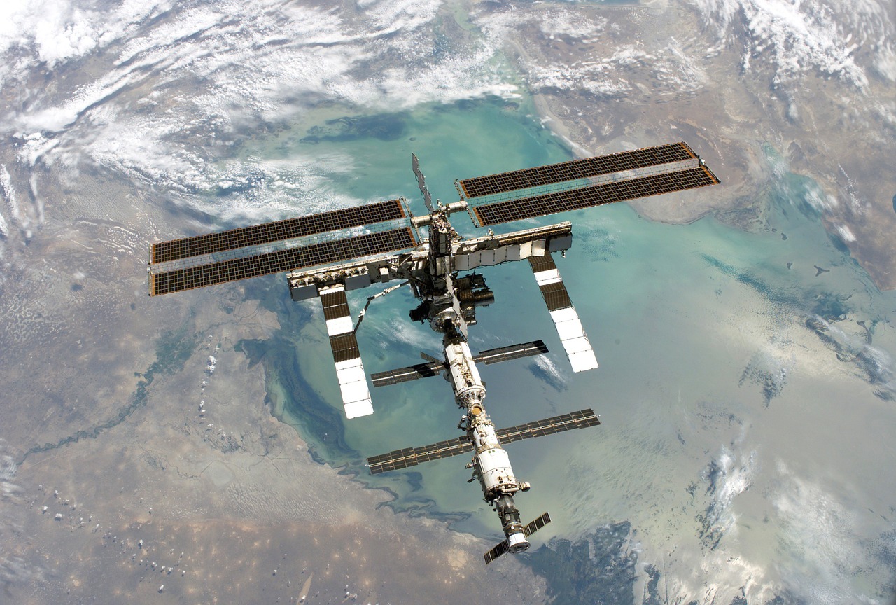 a satellite view of the international space station, by Ken Elias, shutterstock, close establishing shot, tredning on art station, environmental shot, art station ”