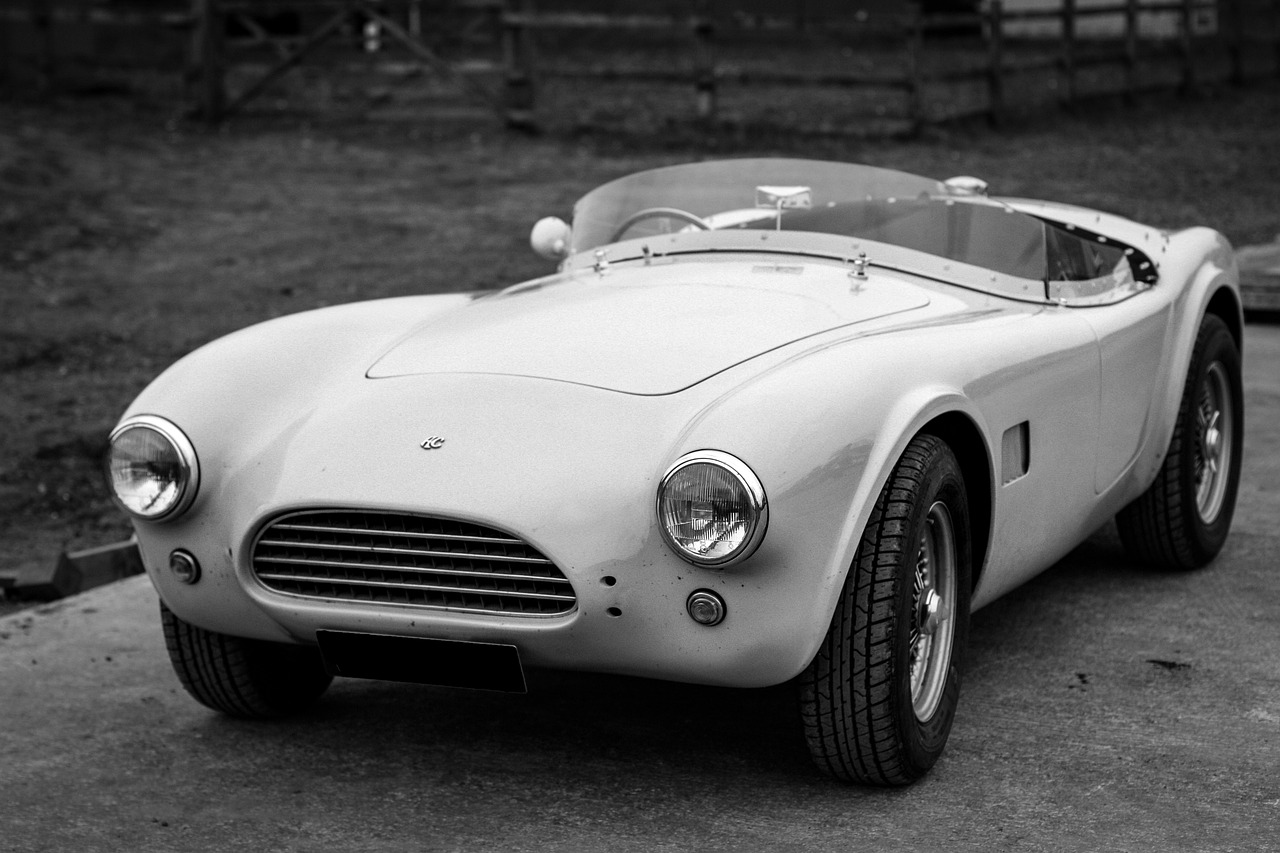 a black and white photo of a sports car, white and grey, restored, albion, 1k hd