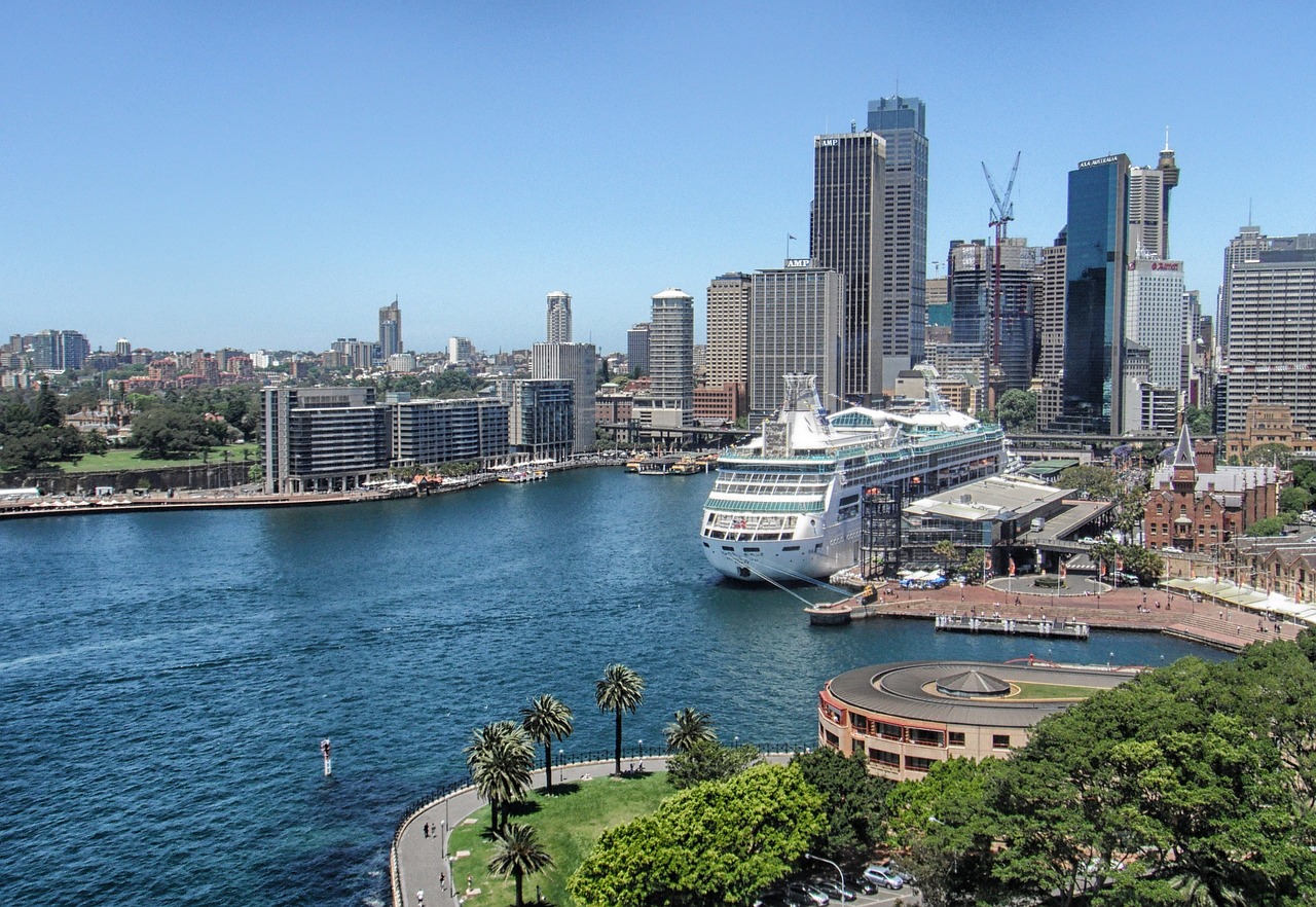 a cruise ship docked in a harbor with a city in the background, inspired by Sydney Carline, hurufiyya, gigapixel photo, city park, wikimedia commons, ultra wide shot