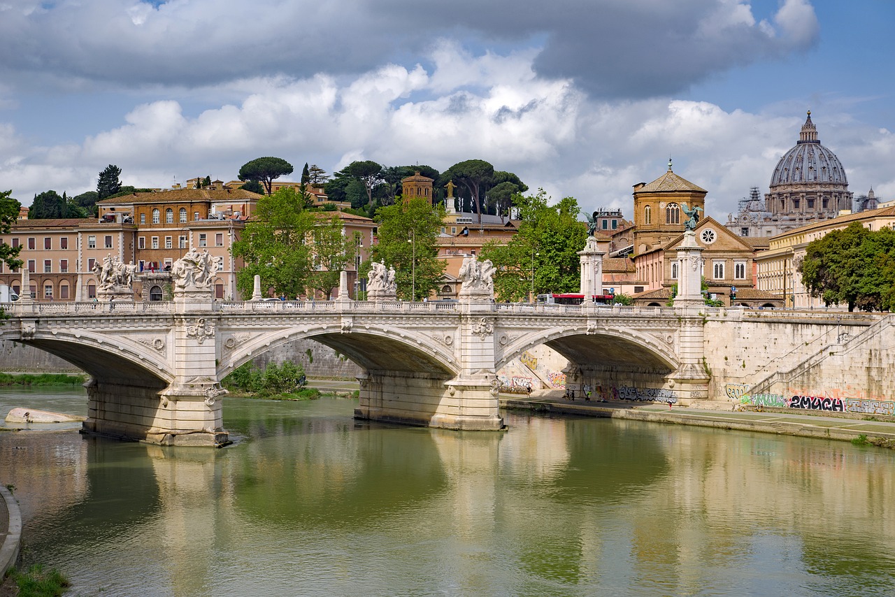 a bridge over a river with buildings in the background, a picture, by Cagnaccio di San Pietro, shutterstock, modern roman empire, stock photo