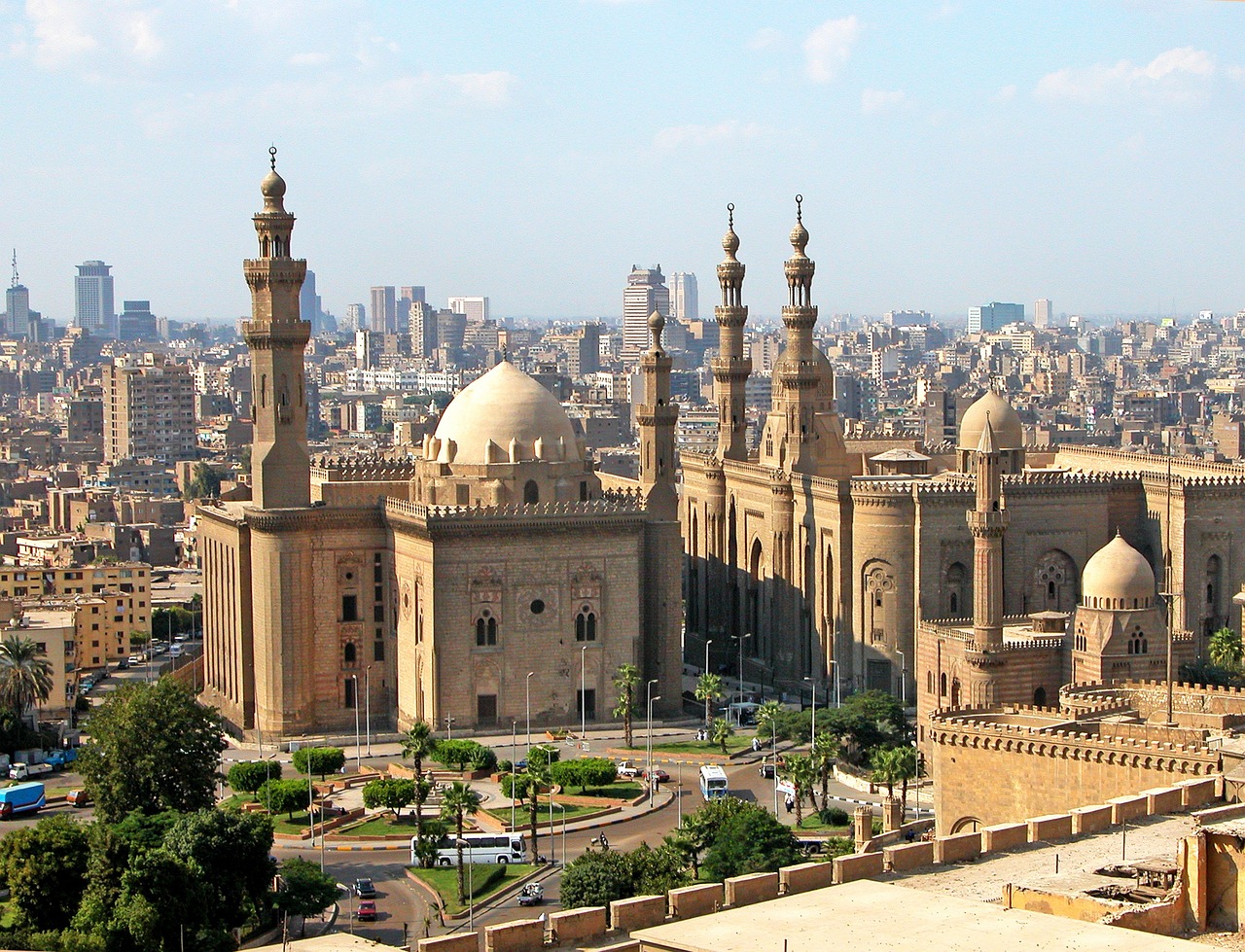 a view of a city from the top of a building, hurufiyya, accurate to egyptian tradition, gothic baroque citadel, spires, wikipedia