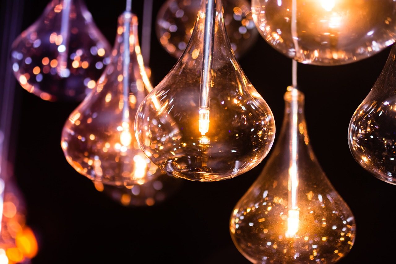 a bunch of light bulbs hanging from a ceiling, light and space, bokeh intricate details, orange and purple electricity, liquid light, accent lighting : : peugot onyx