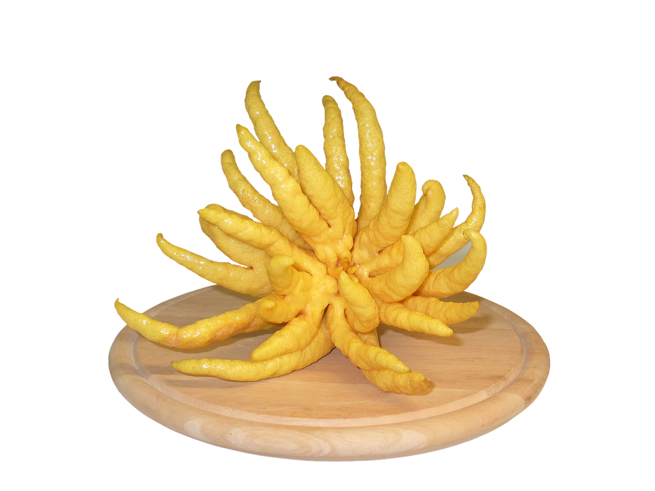 a pile of yellow chili sitting on top of a wooden cutting board, a surrealist sculpture, by Kishi Ganku, trending on zbrush central, new sculpture, jungle fruit, gnarled fingers, full - view, nine tails