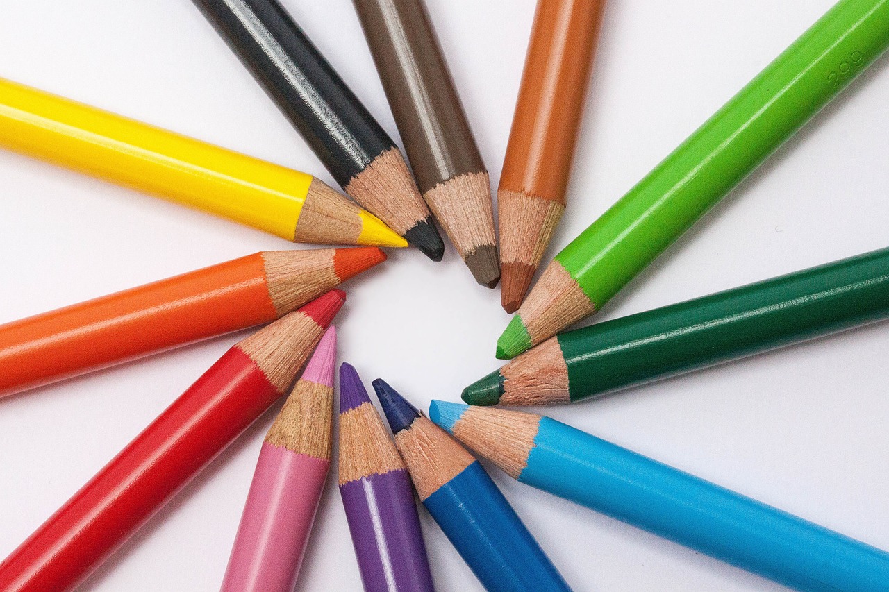 a group of colored pencils arranged in a circle, by Edward Corbett, high quality product image”