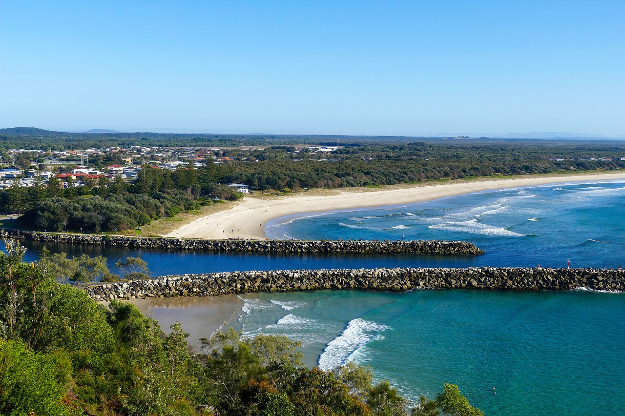 a view of a beach from the top of a hill, by Elizabeth Durack, shutterstock, harbour in background, panoramic shot, myrtle, 4k photo”