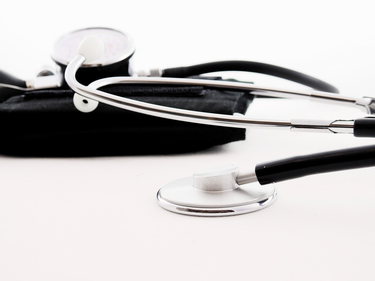 a close up of a stethoscope on a table, happening, black on white, istockphoto, broadshouldered, portlet photo