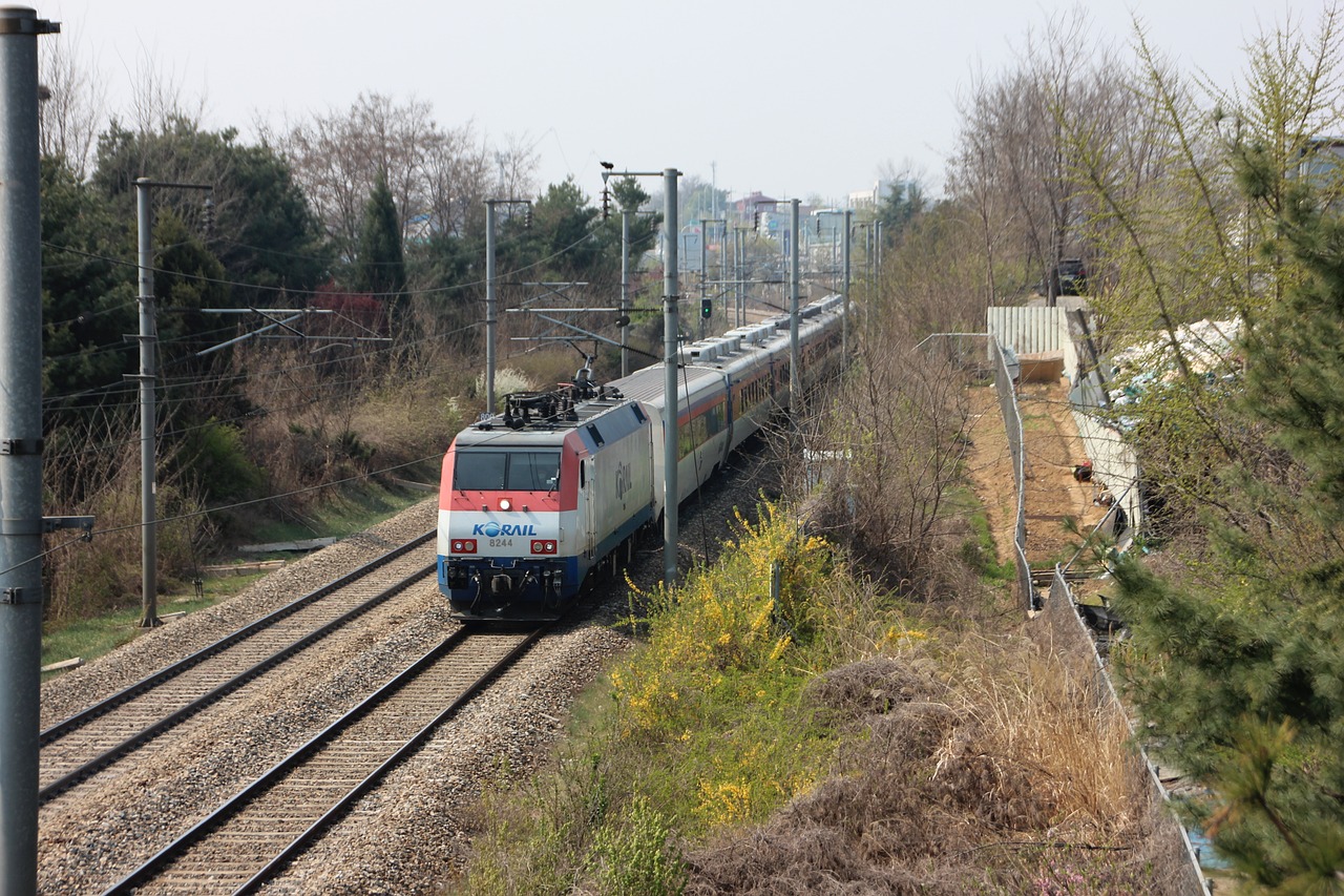 a large long train on a steel track, shutterstock, greek romanian, springtime morning, shot from a distance, high speed trains
