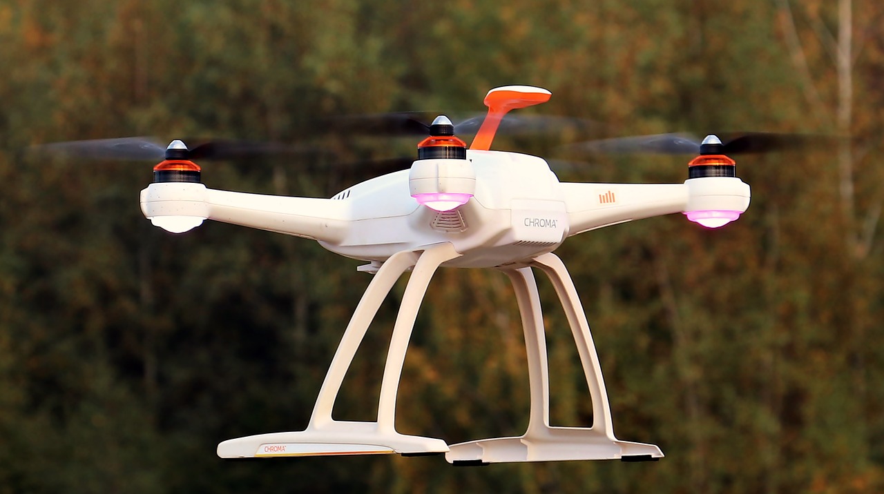 a small white drone flying in the air, by Jakob Gauermann, pixabay, white and orange, ultra high quality model, in 2 0 1 5, ultra 4k