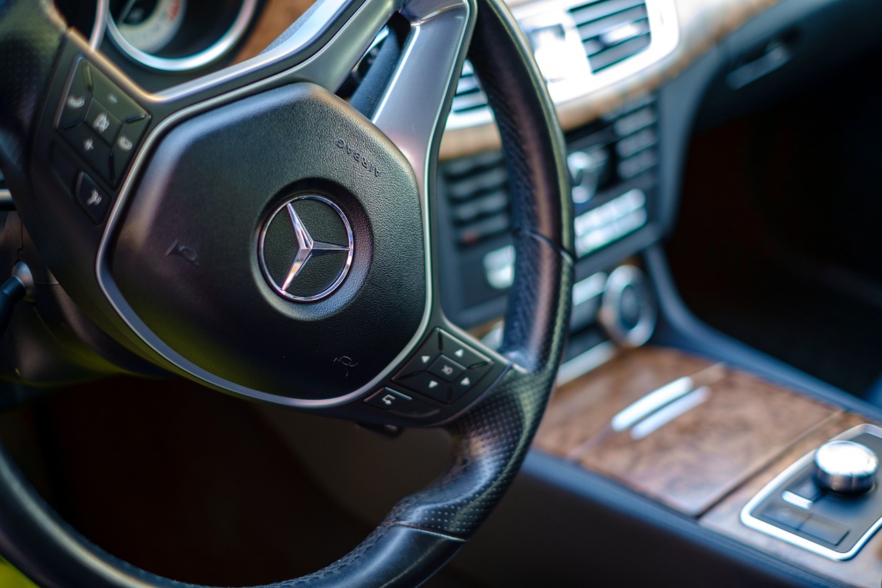 a close up of a steering wheel in a car, by Matthias Weischer, les automatistes, mercedez benz, istock, leather, high quality detailed