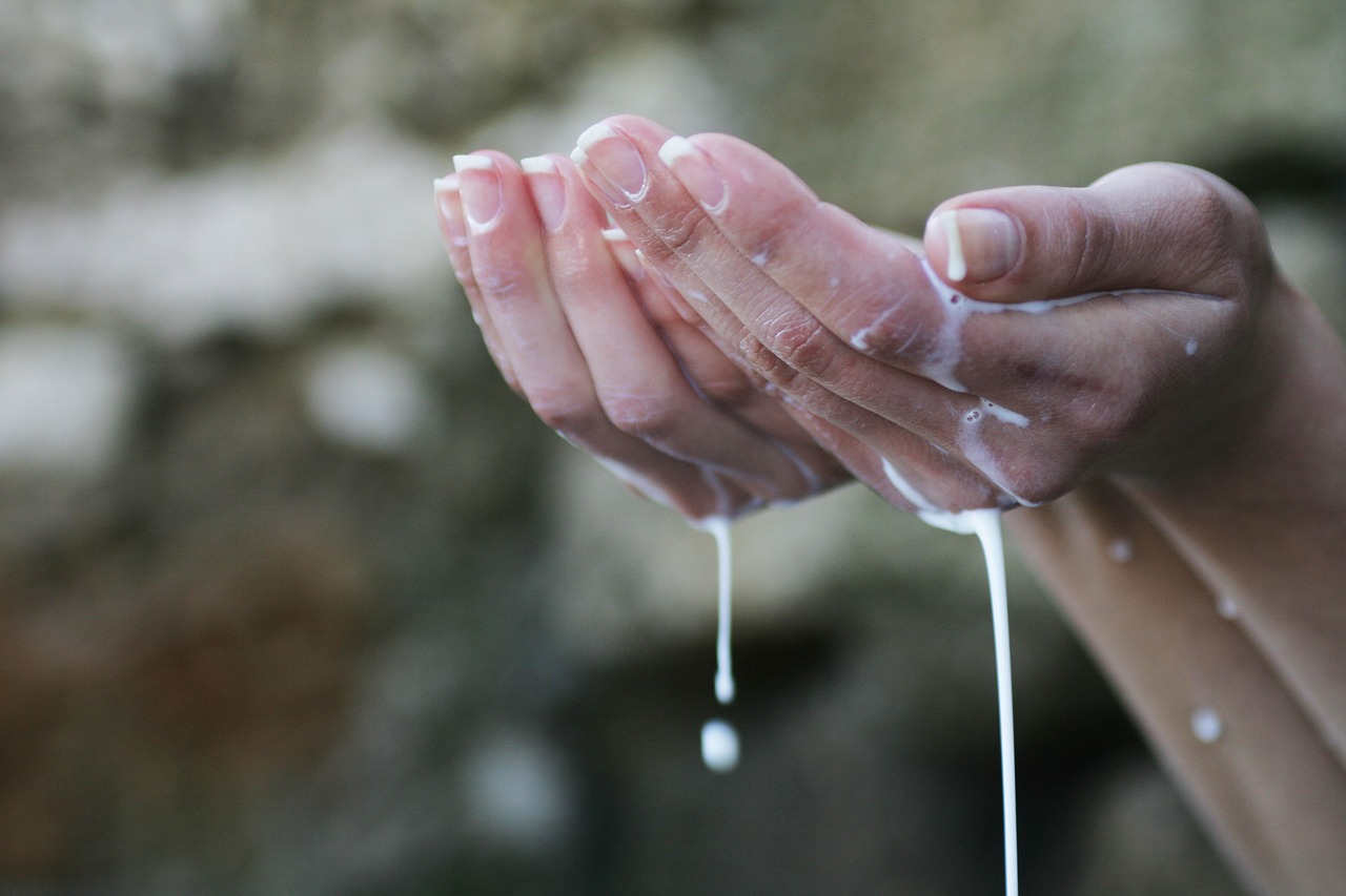 a person is washing their hands with soap, by Matija Jama, shutterstock, renaissance, prayer hands, puddle of milk, avatar image, close - up photo