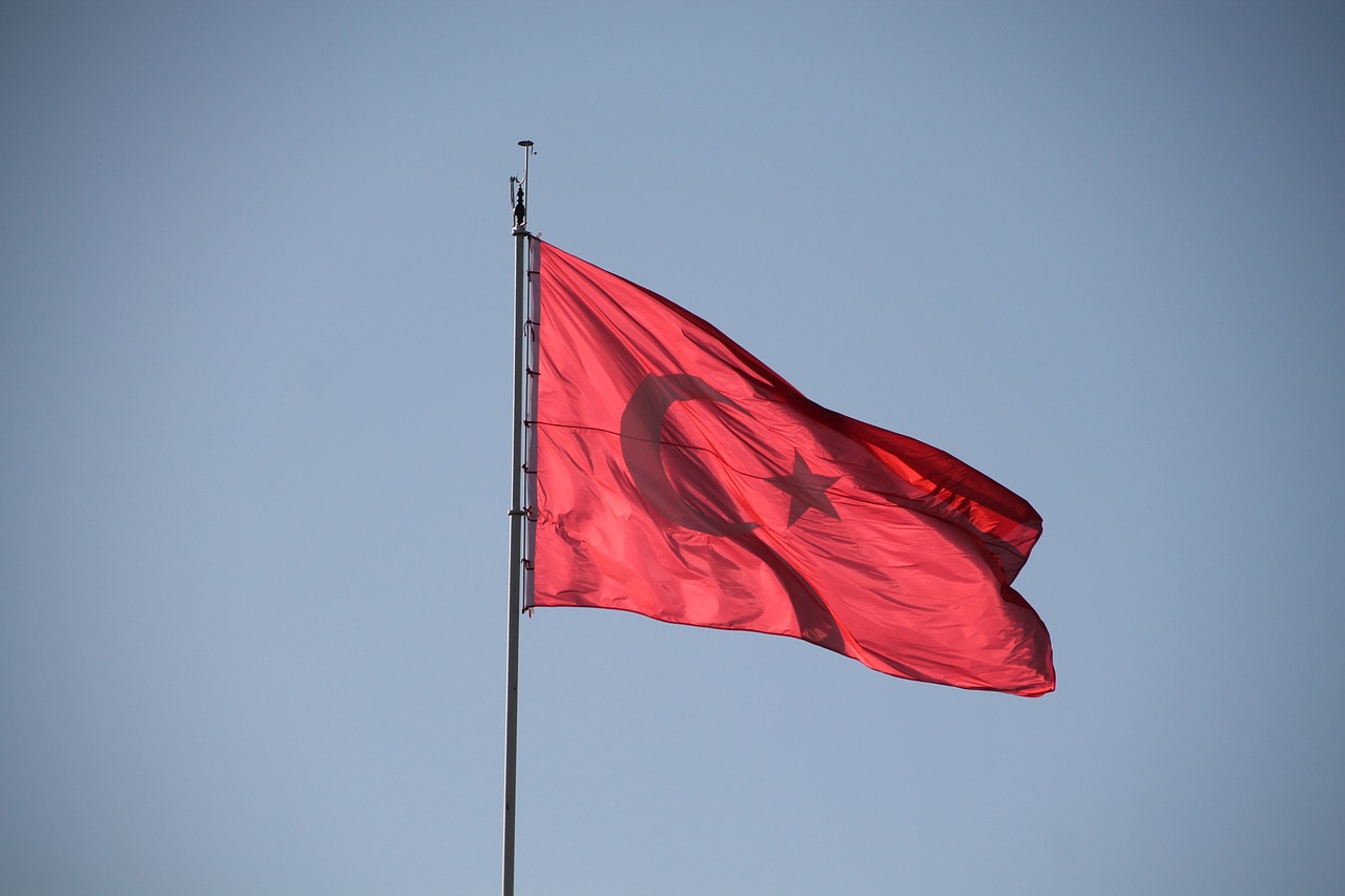 a red flag flying high in the sky, hurufiyya, silver, thanks, high res photo