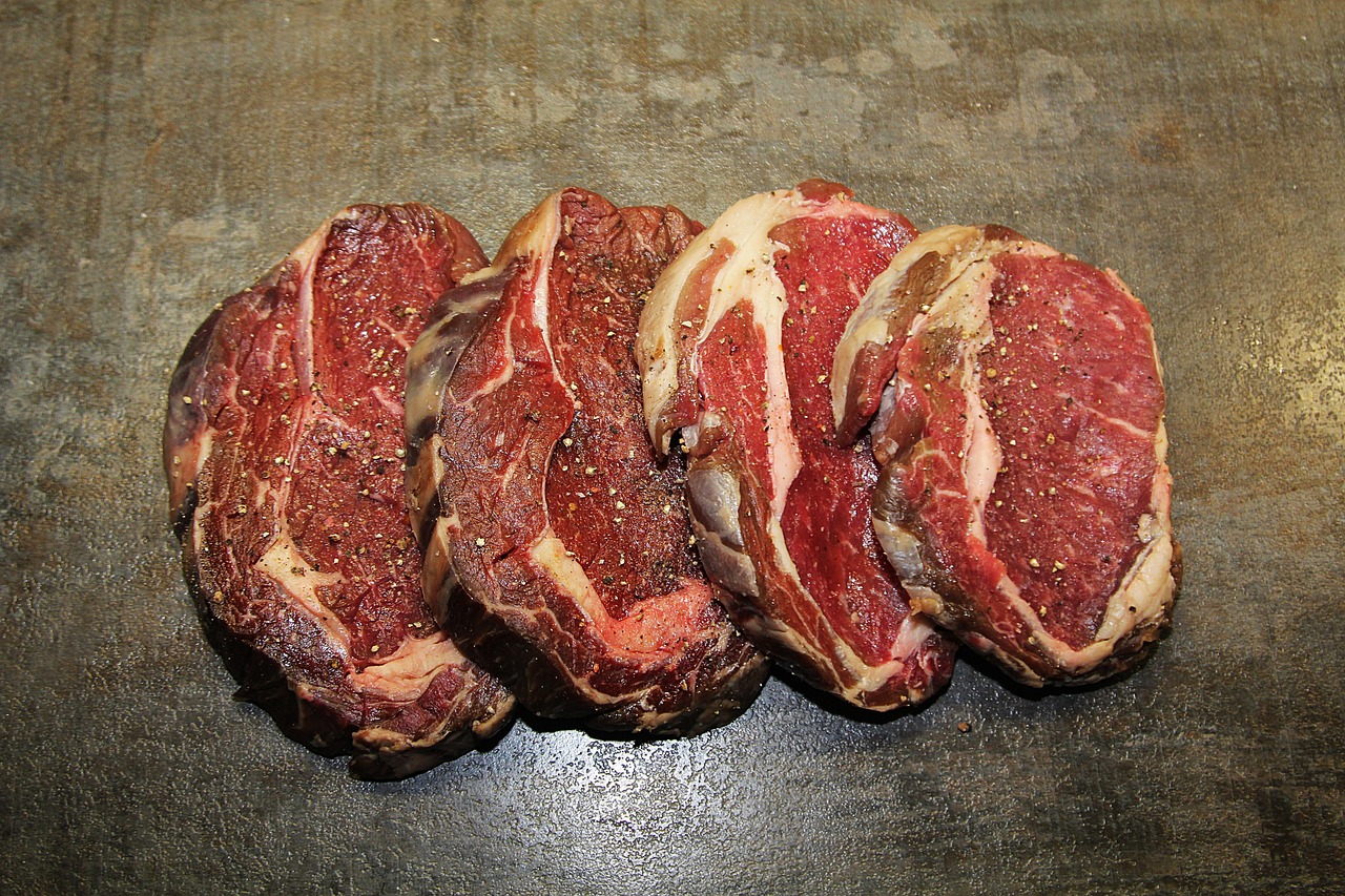 a bunch of meat sitting on top of a table, three fourths view, steakpunk, view from the side”, muttonchops