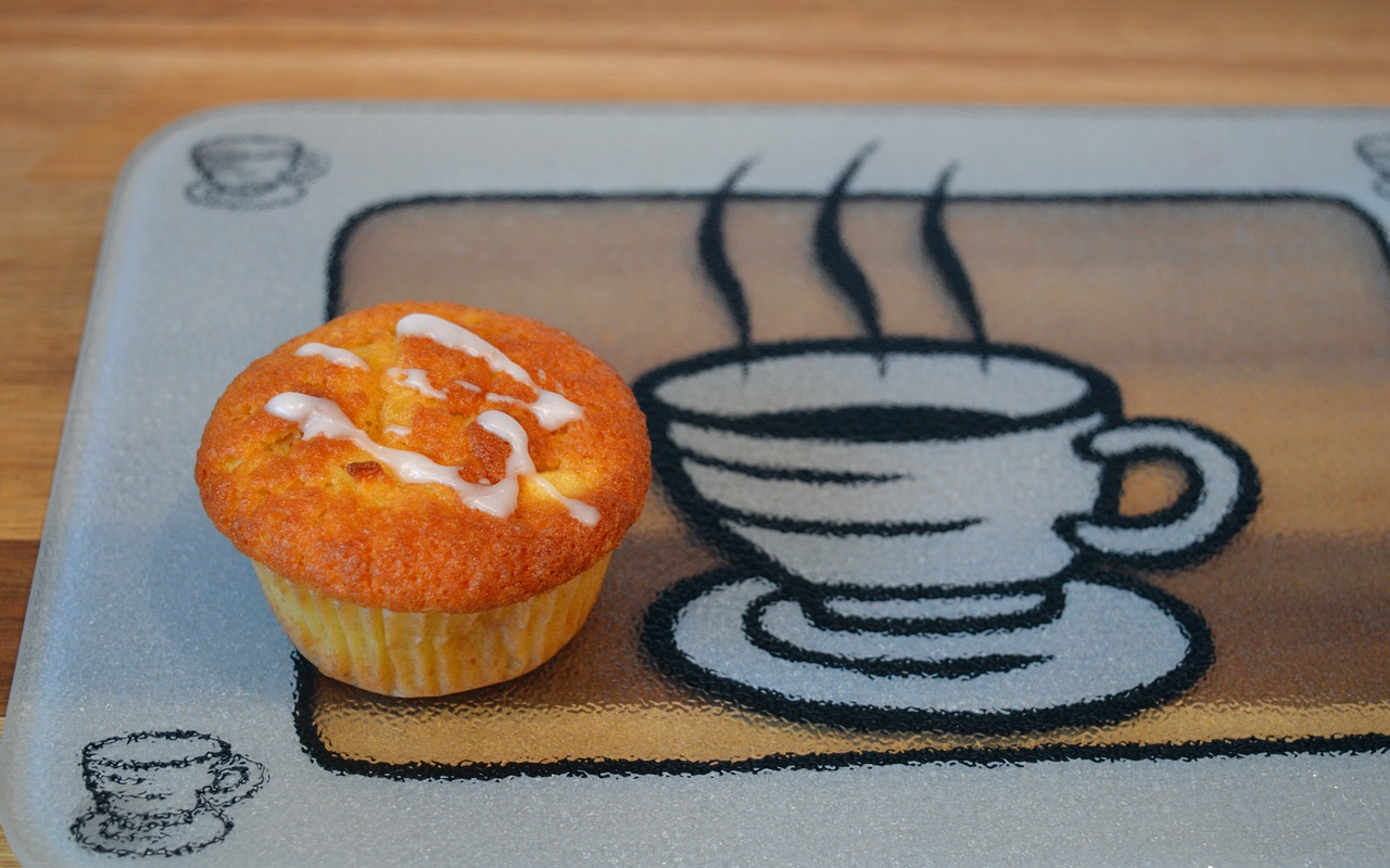 a cup of coffee and a muffin on a plate, by Ayako Rokkaku, flickr, silicone patch design, on a velvet table cloth, hand-drawn, fog!