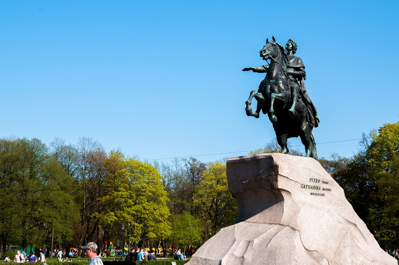 a statue of a man on a horse in a park, by Serhii Vasylkivsky, figuration libre, on a bright day, during spring, hestiasula head, seen from the side