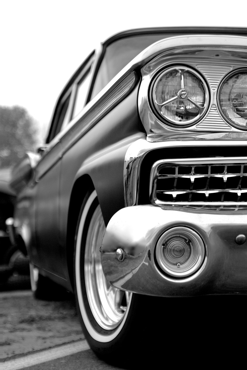 a black and white photo of a classic car, lowbrow, phone wallpaper, vibrant - c 10, gleaming silver, mercury