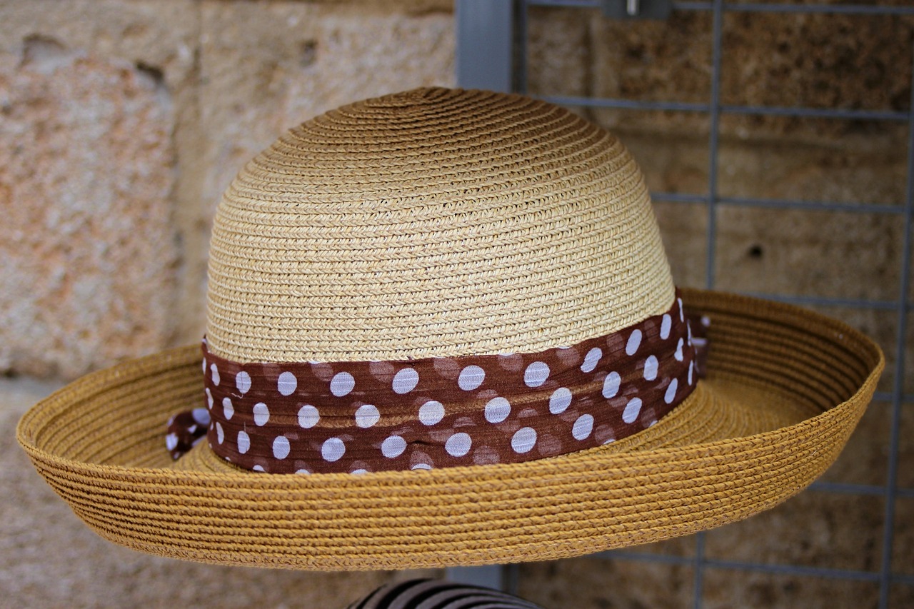 a straw hat with a polka dot band, by David Garner, flickr, random detail, brown colours, france, square