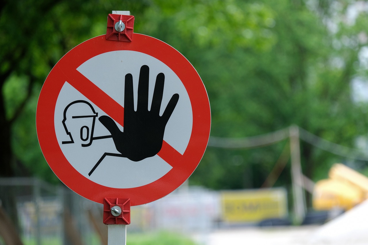 a red and white sign sitting on the side of a road, a picture, by Alexander Fedosav, pixabay, street art, hand with five fingers, wearing a stop sign on its head, dangerous chemical hazards, yaroslav tokar