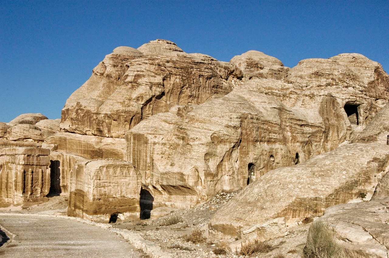 a man riding a horse down a dirt road, a detailed matte painting, flickr, les nabis, in a large desert cave, jordan, stone carvings, w 1024