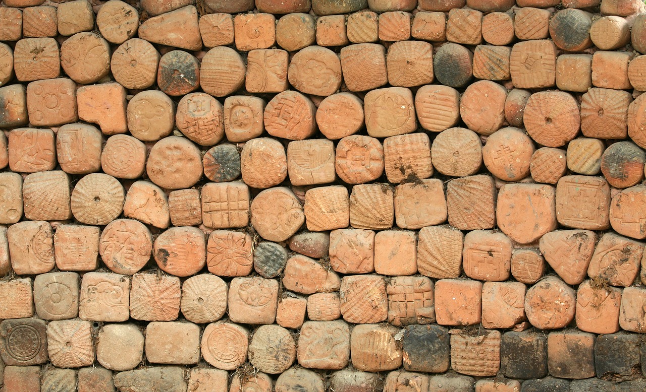 a close up of a wall made of bricks, folk art, 1 8 th century south america, clay amulets, geometry, taken with a pentax1000
