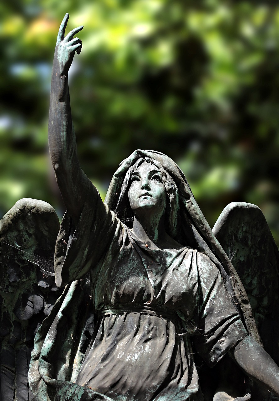 a close up of a statue of an angel, pixabay, art nouveau, black wings instead of arms, waving, from wheaton illinois, female looking