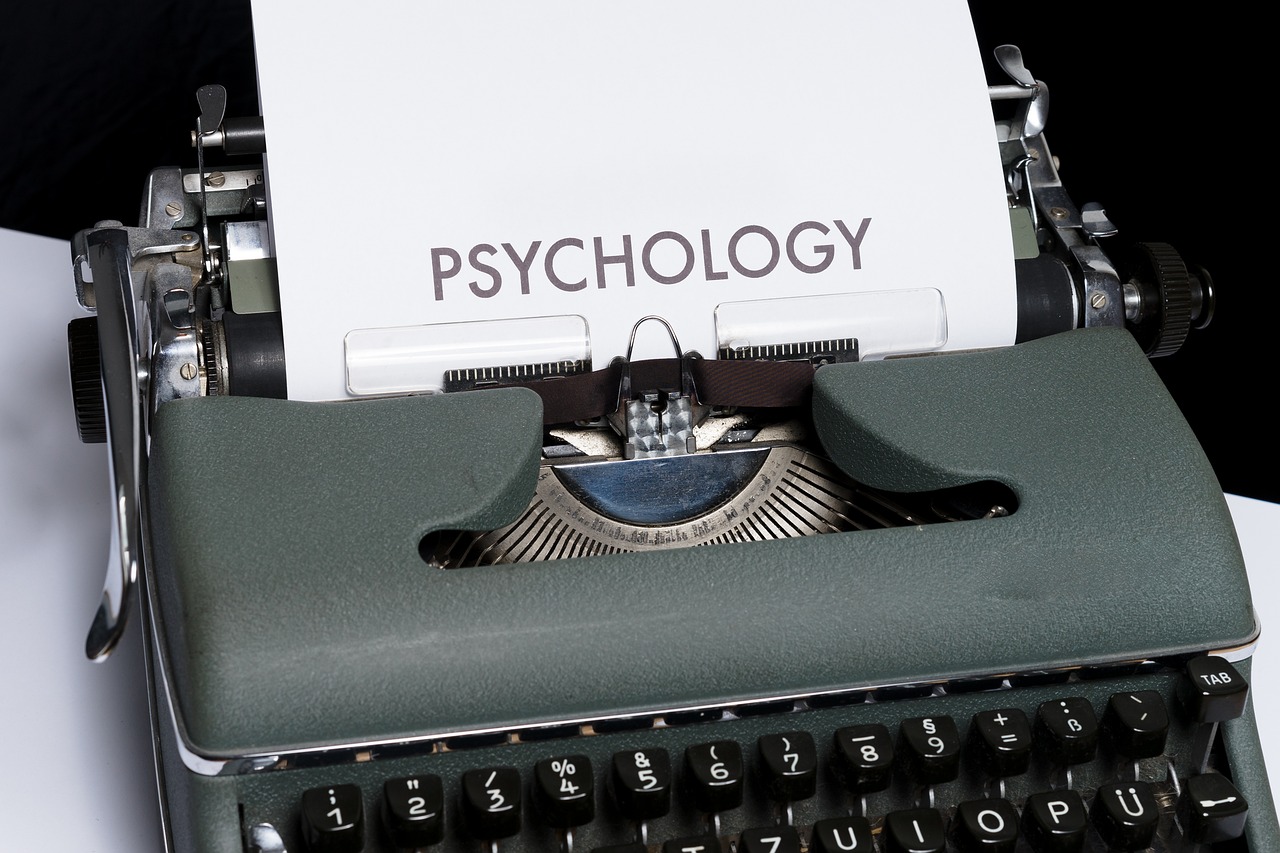 a close up of a typewriter with a paper on it, a portrait, by Kurt Roesch, pixabay, precisionism, 1 9 6 0 s psychology book cover, brain connected to computer, an independent psycho, stock photo