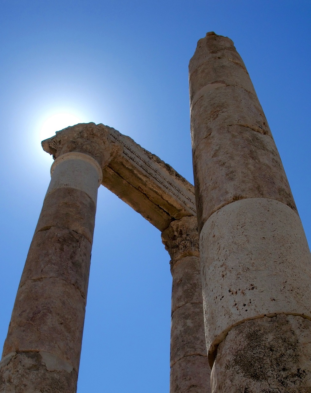 a couple of tall pillars sitting next to each other, flickr, romanticism, jordan, clear and sunny, apollo, leading to the sky