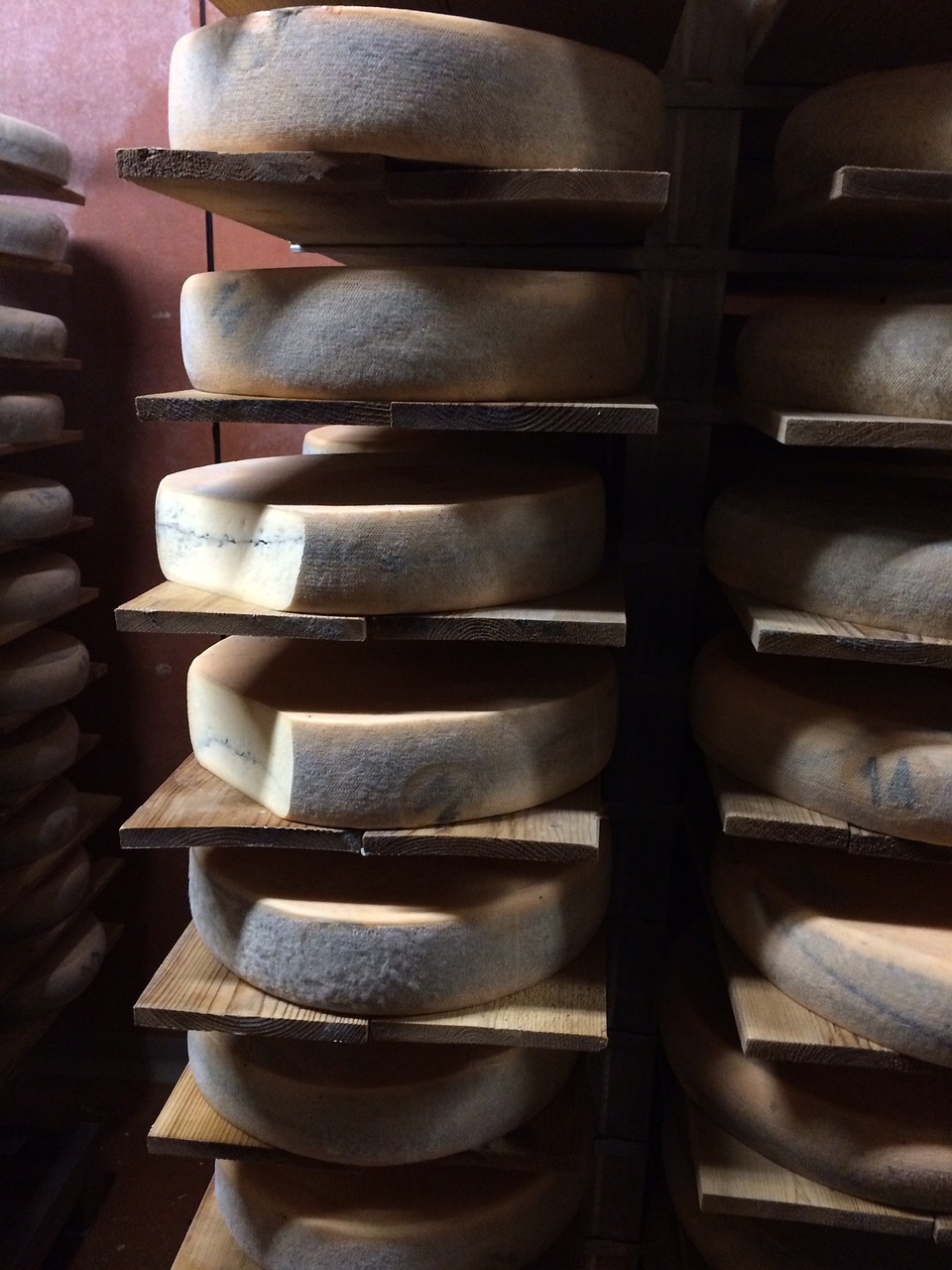 a bunch of cheese stacked on top of each other, by Johannes Martini, mingei, phone photo, curved horns!, ohio, the back rooms