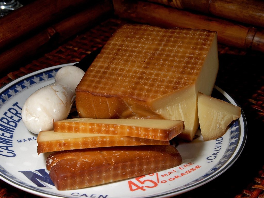 a close up of a plate of food on a table, flickr, mingei, made of cheese, boroque, cane, lattice