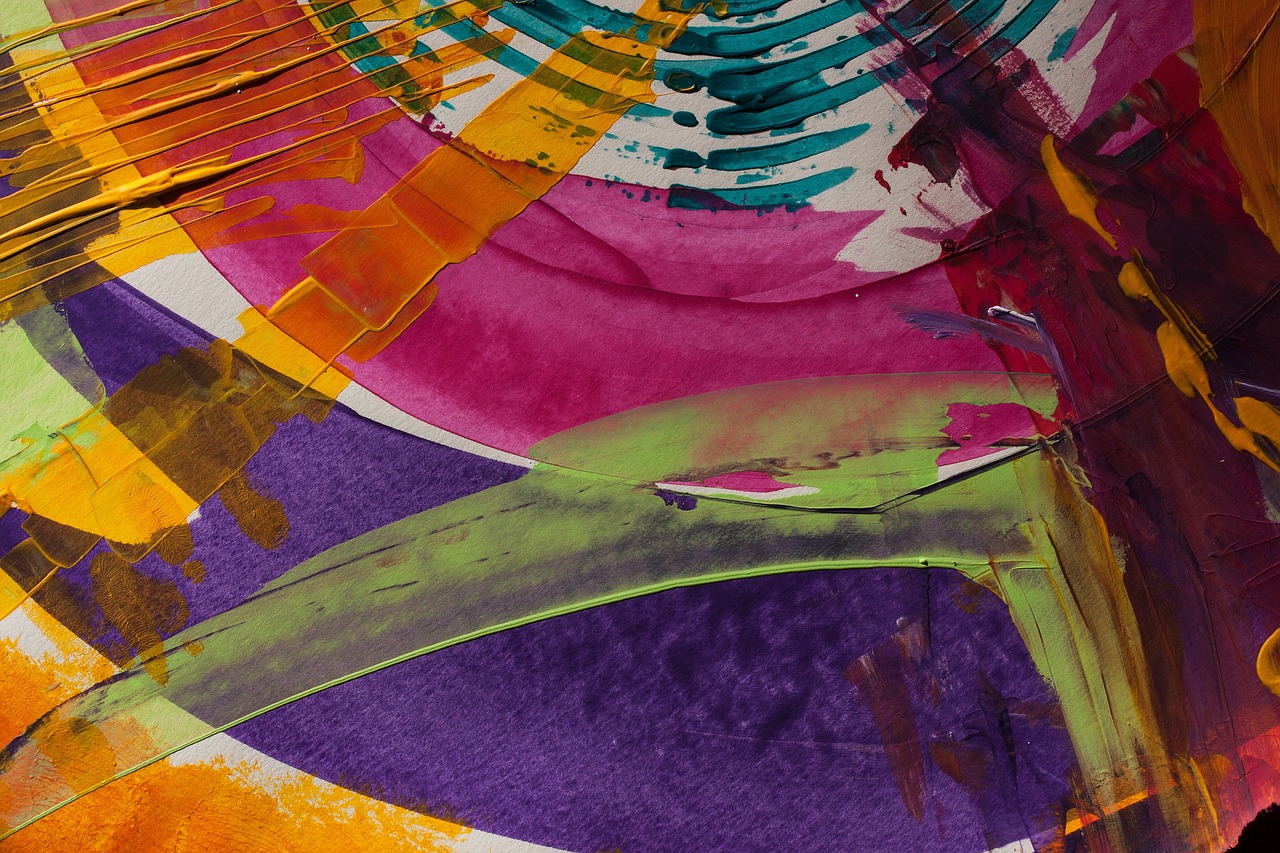 a close up of a painting on a piece of paper, inspired by Kenneth Noland, flickr, lsd feathers, vibrant fan art, circle forms, gold green and purple colors”
