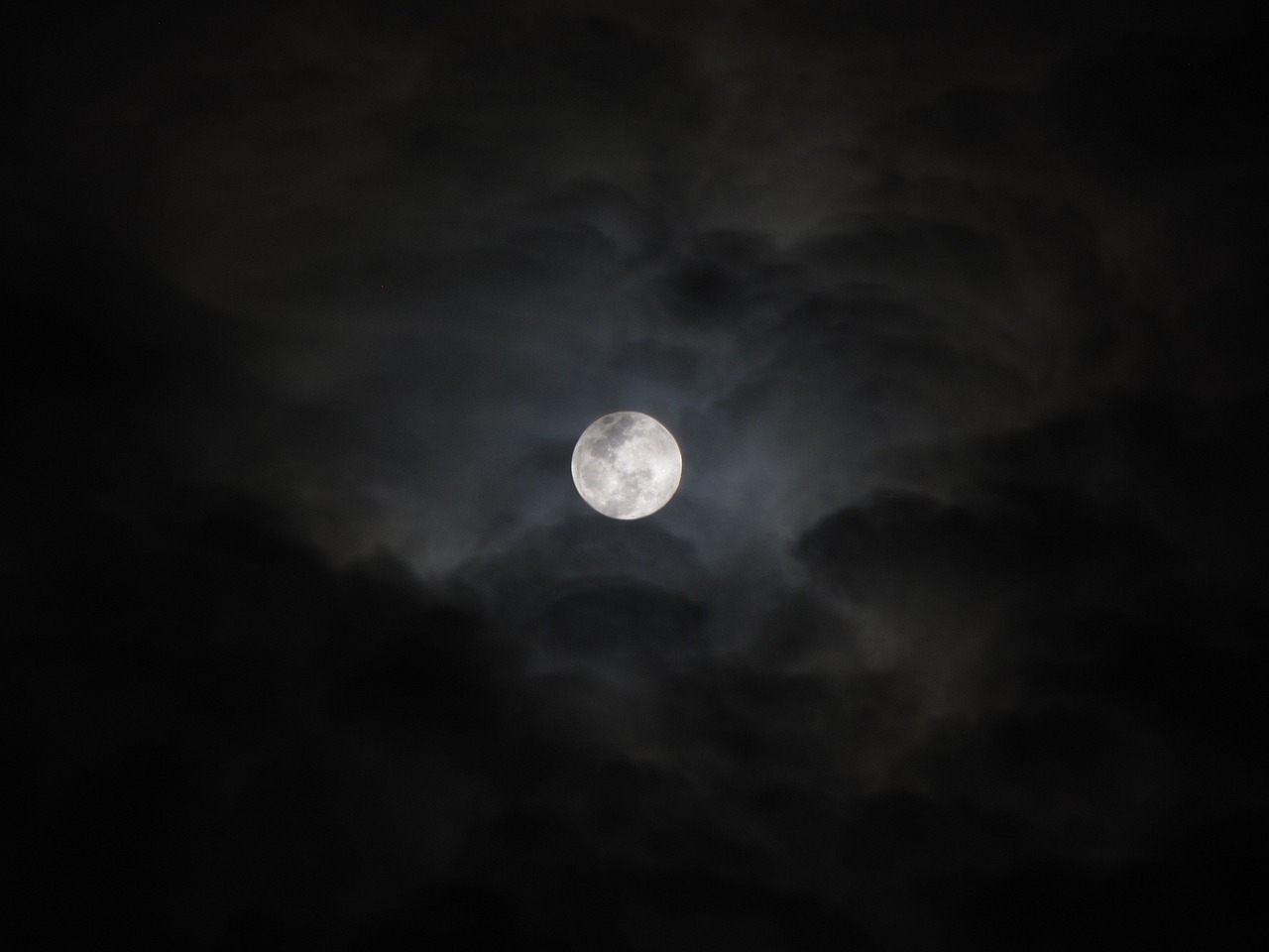 a full moon is seen through the clouds, by Jan Konůpek, pexels, hurufiyya, 1 6 6 7, menacing!, 3 0 0, moon goddess