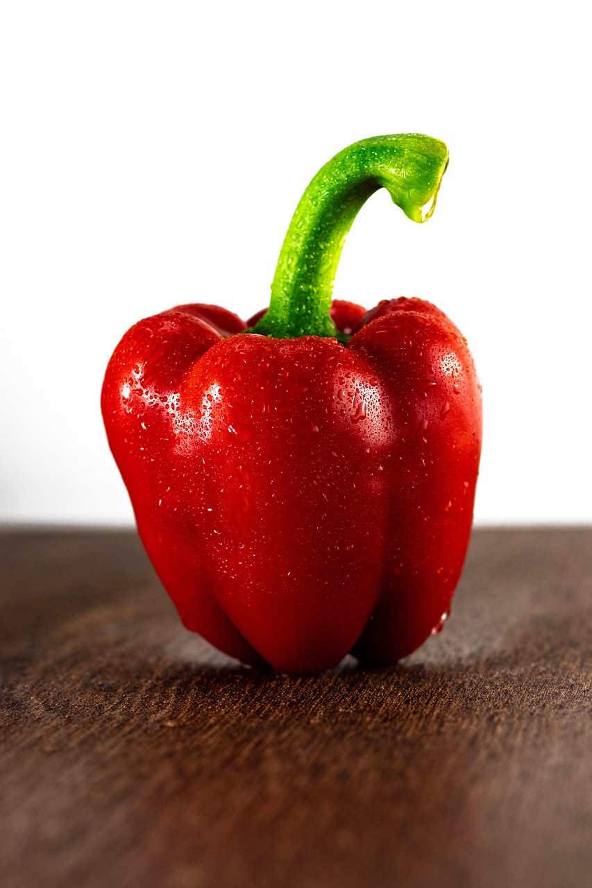 a red pepper sitting on top of a wooden table, a picture, renaissance, professional fruit photography, close-up product photo, product introduction photo, transparent background