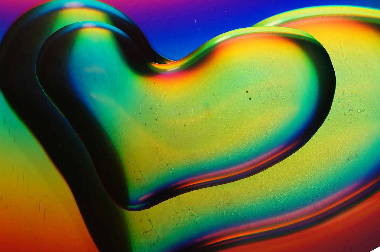 a close up of a heart shaped object, by Doug Ohlson, flickr, lyrical abstraction, rainbow liquids, david la chapelle, abstraction chemicals, dmt waves