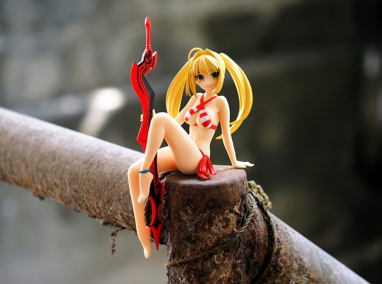 a close up of a figurine of a woman on a branch, inspired by Masamune Shirow, tumblr, figuration libre, blonde girl, red bikini, on the concrete ground, twintails