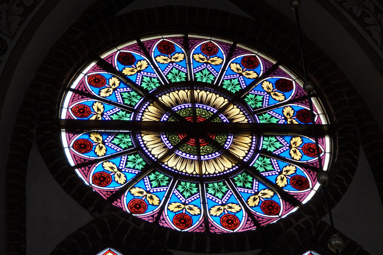 a close up of a stained glass window in a building, by Karl Völker, flickr, rosette, round window, helmond, cathedral ceiling