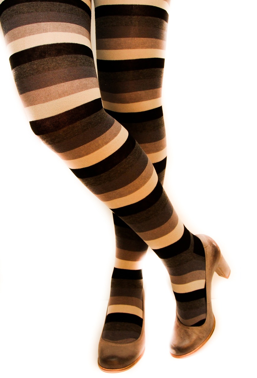 a woman wearing striped stockings and high heels, flickr, op art, brown color palette, product introduction photo, soft - warm, black and brown colors