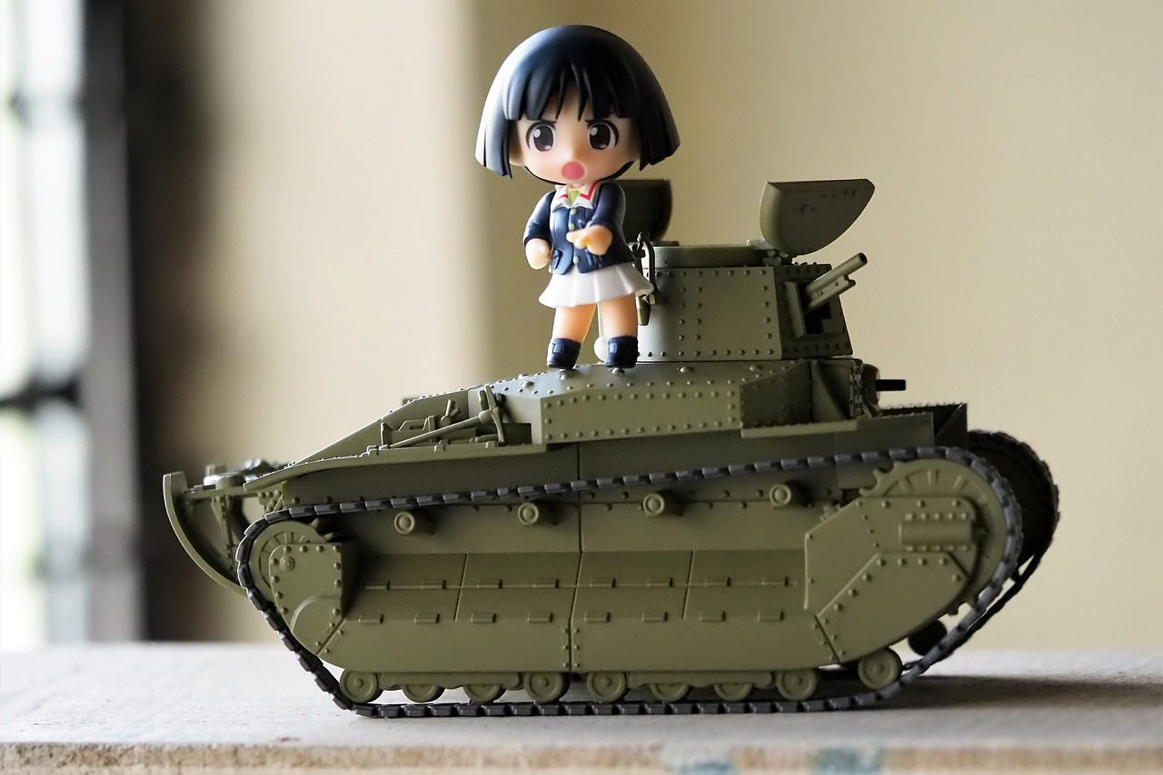 a close up of a toy tank on a table, a picture, by Hiroyuki Tajima, flickr, figuration libre, small loli girl, female explorer mini cute girl, standing on a battlefield, nichijou