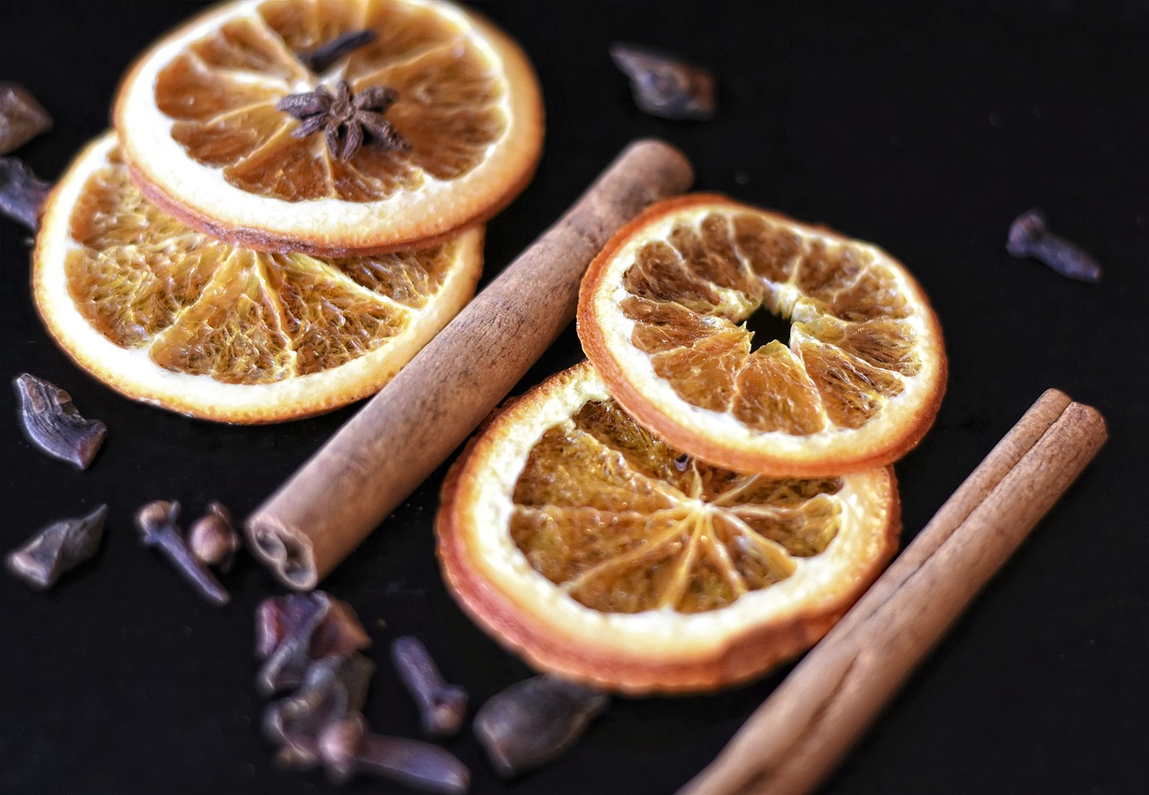 a bunch of orange slices sitting on top of a table, renaissance, spices, cinamtic, very crisp details, charioscuro