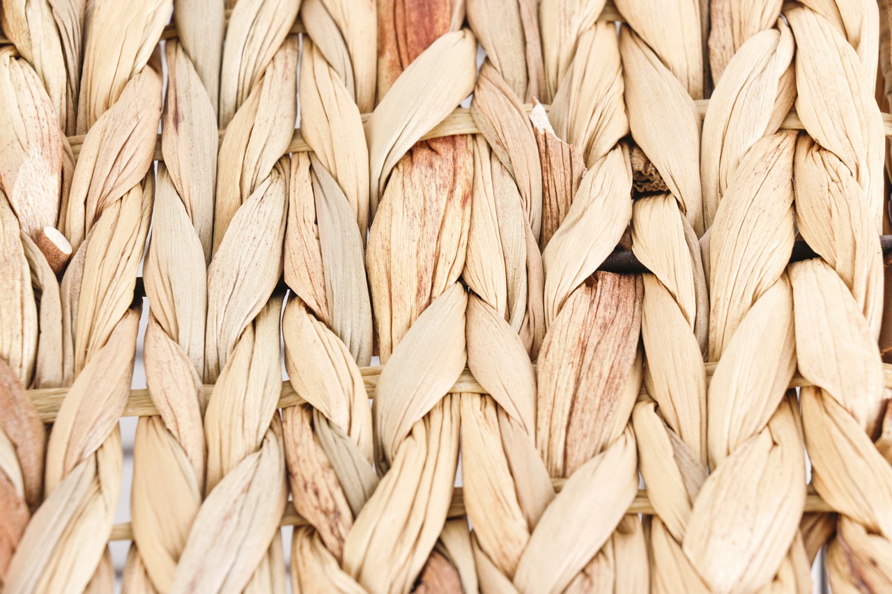 a close up view of a woven basket, a macro photograph, shutterstock, highly detailed product photo, flax, close-up product photo, dried leaves