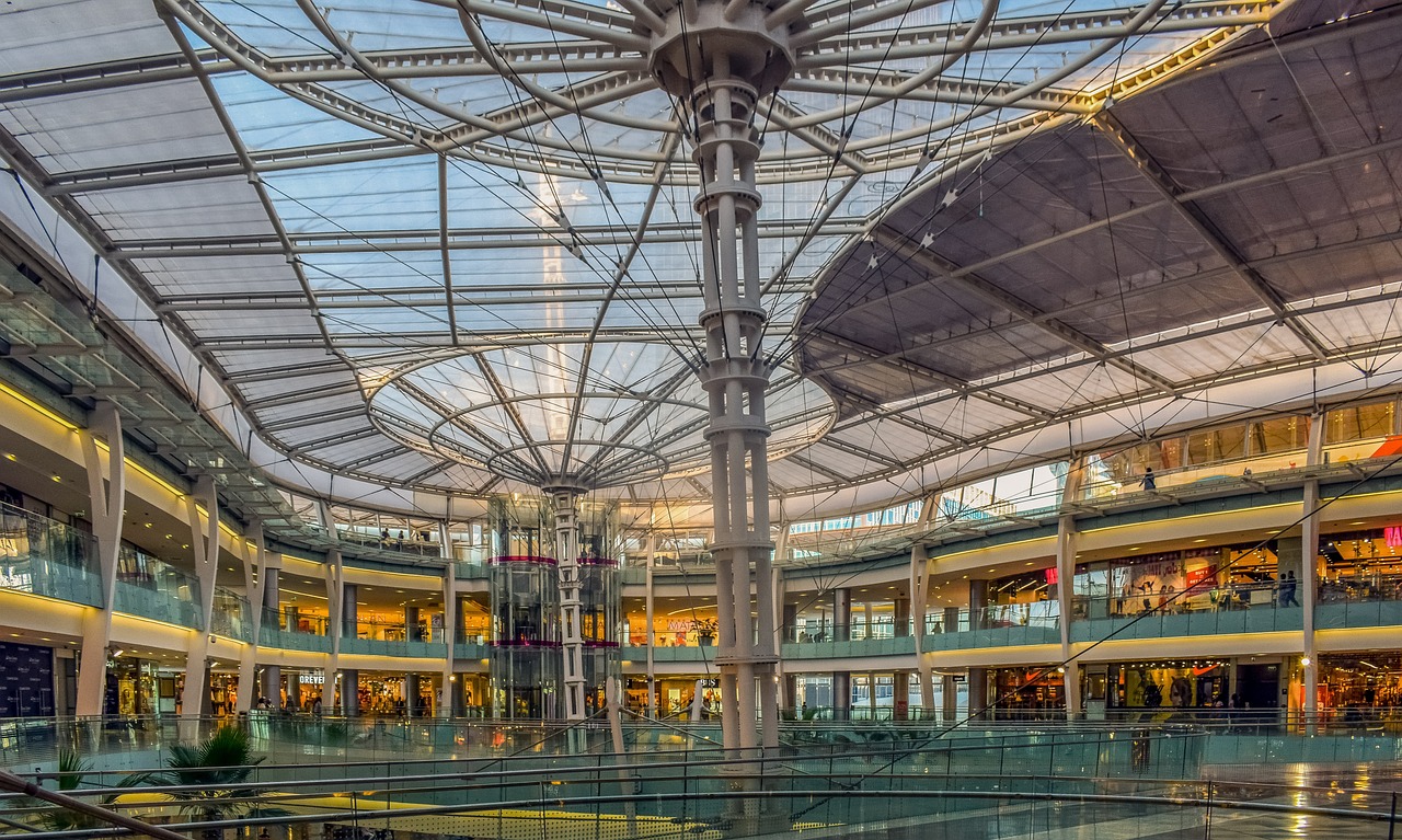 a view of the inside of a shopping mall, by Jakob Gauermann, shutterstock, huge glass structure, panorama shot, 🕹️ 😎 🔫 🤖 🚬, canopies