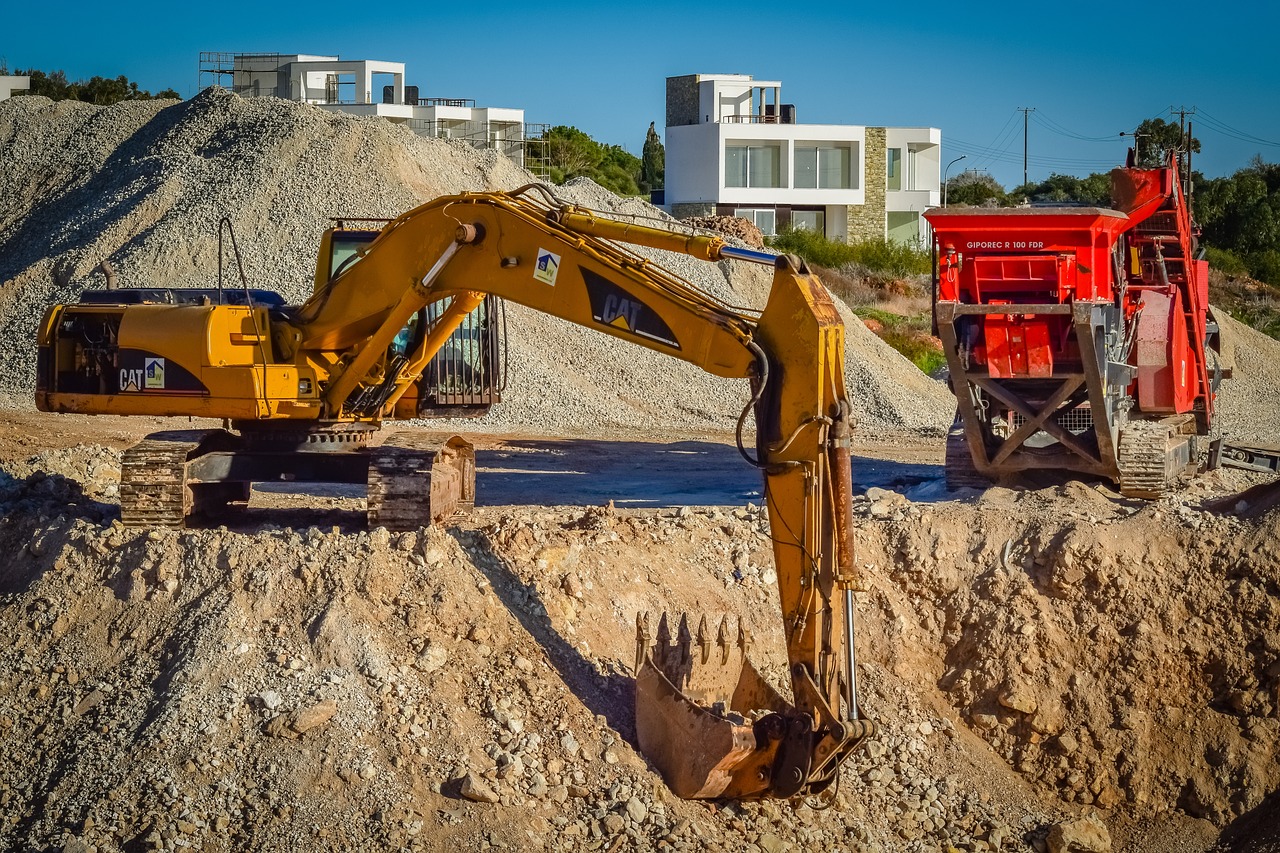 a bulldozer sitting on top of a pile of dirt, a photo, by Lee Loughridge, shutterstock, massive construction machines, trench sandbags in background, wide shot photo, big shovel