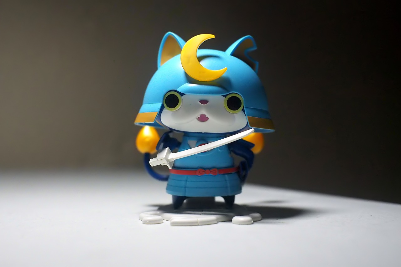 a close up of a toy on a table, concept art, inspired by Miao Fu, flickr, samurai cat, blueish moonlight, funko pop, konosuba
