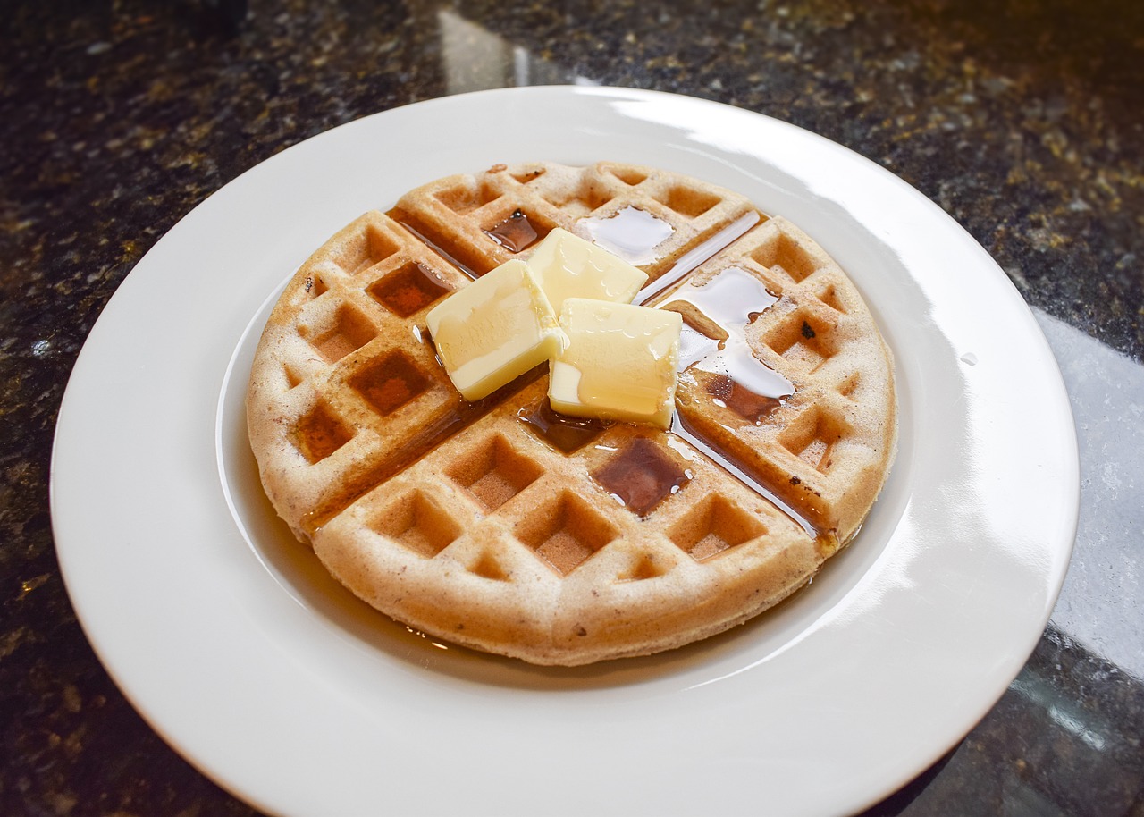 a waffle with butter and syrup on a plate, flickr, high res photo, blog-photo, grind, glazed